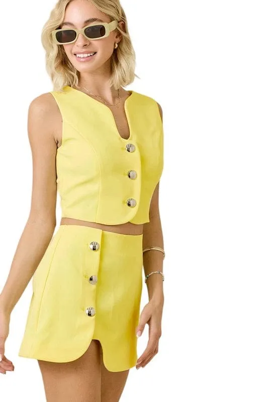 Lemon sleeveless puzzle vest and mini skirt